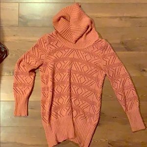 Sweater. Covers butt